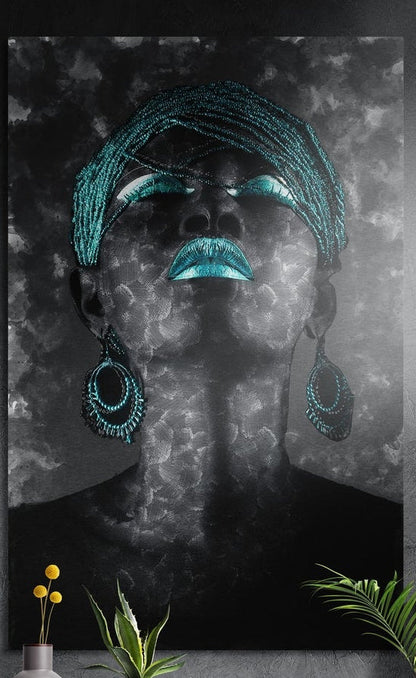 Woman with teal lips, beaded head wrap and hoop earrings, brushed aluminum wall art on a dark wall above plants