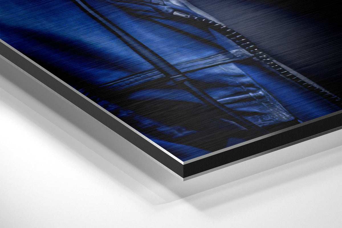 Blue hoodie DJ gorilla brushed aluminum panel corner close-up showing the brushed metal grain