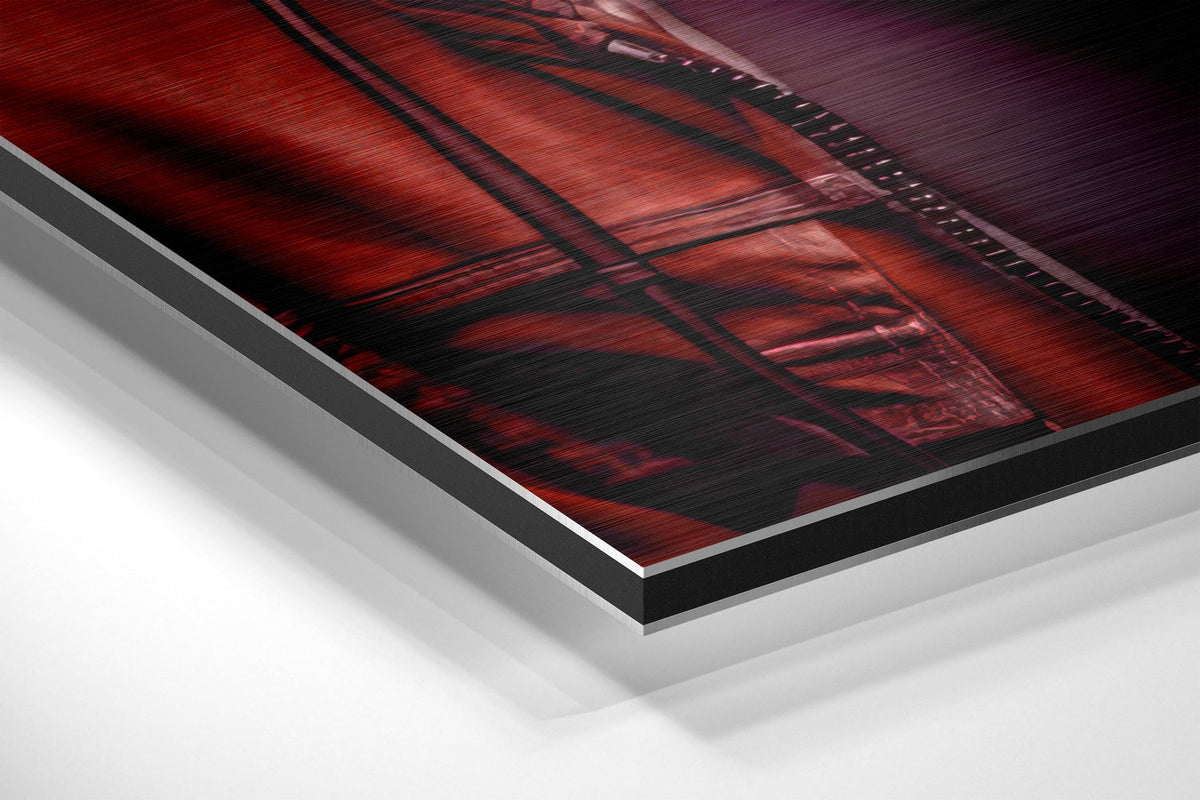 Crimson hoodie DJ gorilla brushed aluminum panel corner close-up showing the brushed metal grain