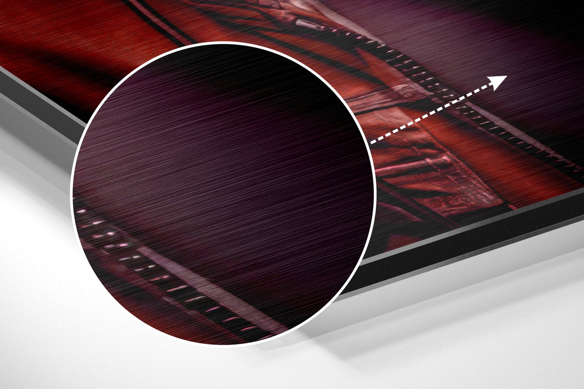 Magnified detail of the brushed metal grain showing through the crimson hoodie DJ gorilla print