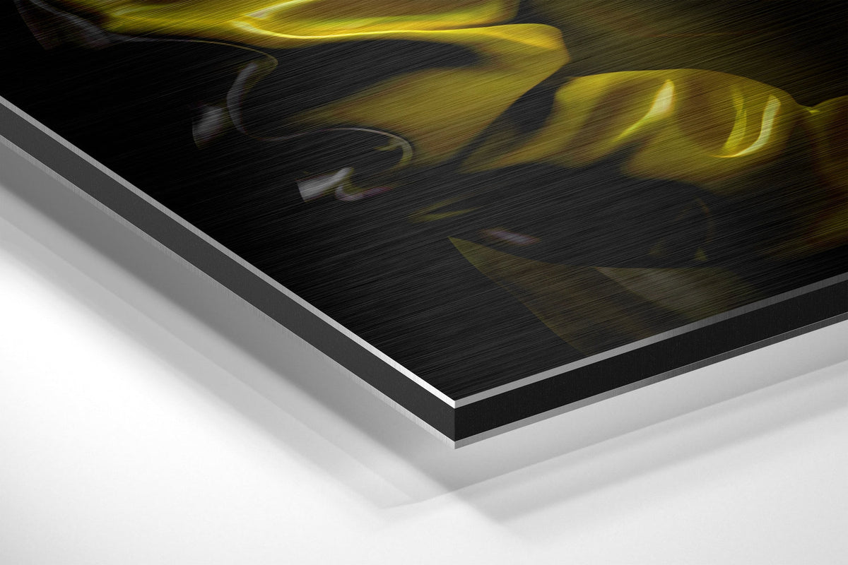 Rhino in yellow jacket brushed aluminum panel corner close-up showing the brushed metal grain