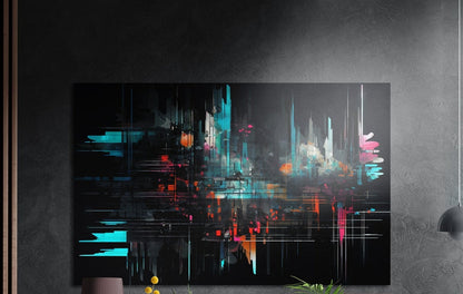Teal glitch abstract cityscape brushed aluminum wall art on a dark textured wall, a lamp and plant tops below