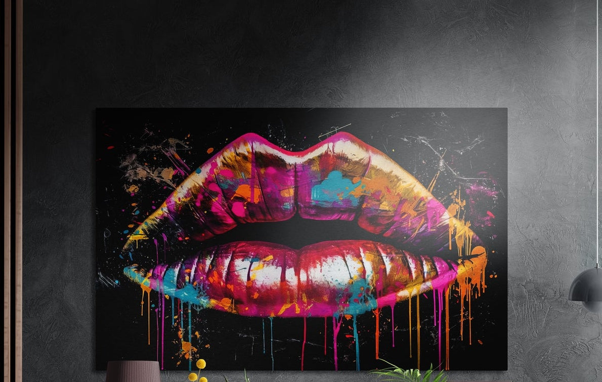 Full lips in pink, red, teal and orange paint with drips on black, wide brushed aluminum wall art on a dark wall