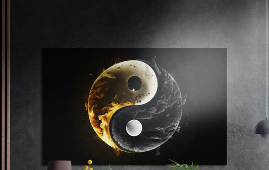 A gold and silver yin yang symbol wrapped in fire and smoke brushed aluminum wall art above yellow flowers and plants