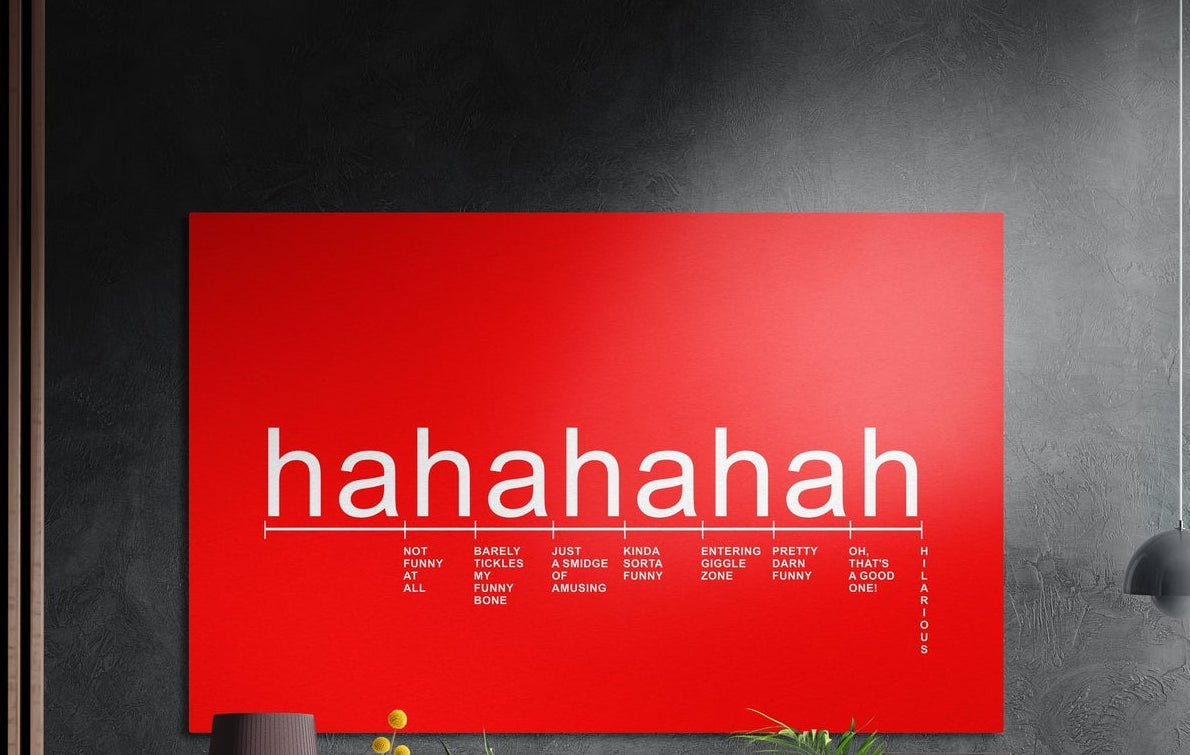 Red laughter scale typography brushed aluminum wall art on a dark textured wall above a vase and plants