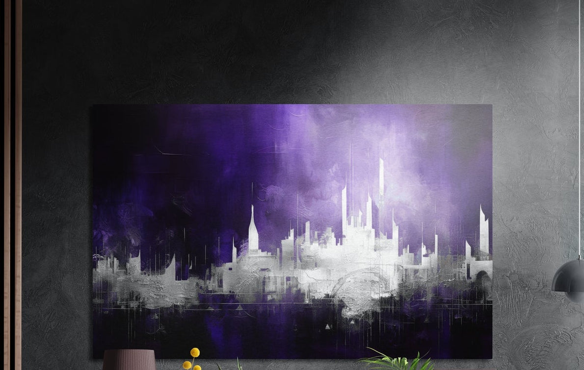 Purple haze city skyline brushed aluminum wall art on a dark textured wall, a lamp and plant tops below