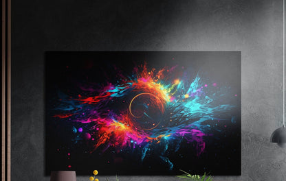Neon pink, orange and blue paint splashes swirling around a ring on black, brushed aluminum wall art on a dark textured wall