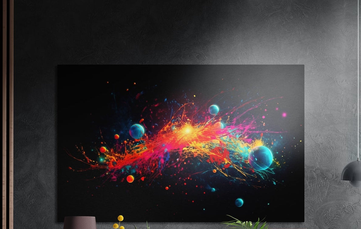 Planets and paint splash brushed aluminum wall art on a dark gray wall above a mauve lamp and potted plants