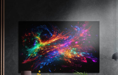 Rainbow ribbon nebula brushed aluminum wall art on a dark textured wall above a lamp and plants