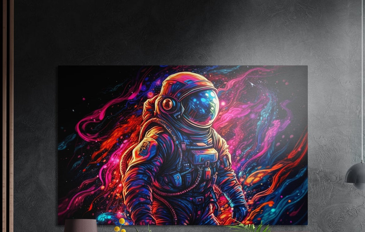 Astronaut in neon paint swirls brushed aluminum wall art on a dark textured wall above a lamp and plants