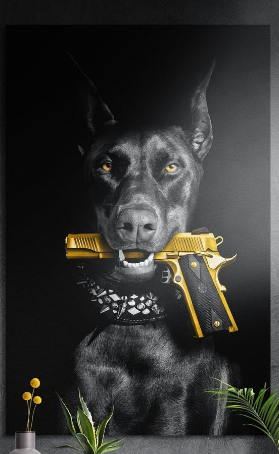 Black Doberman with a gold pistol in its mouth, brushed aluminum wall art on a dark wall above a vase and plants