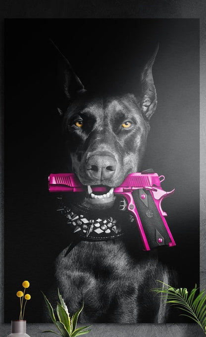 Black Doberman with a pink pistol in its mouth, brushed aluminum wall art on a dark wall above a vase and plants