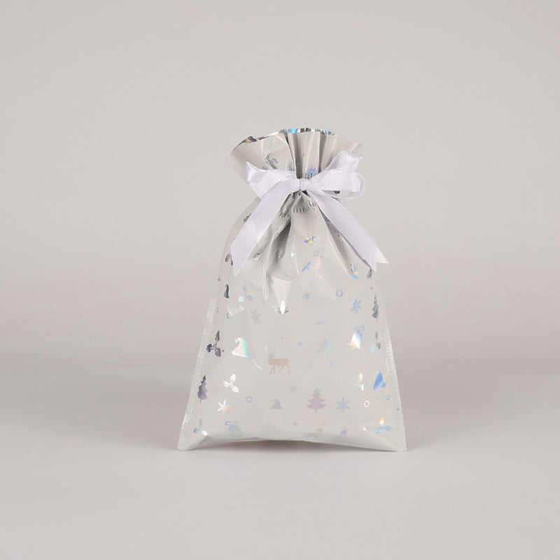 Gift bag with a white ribbon on a light gray background