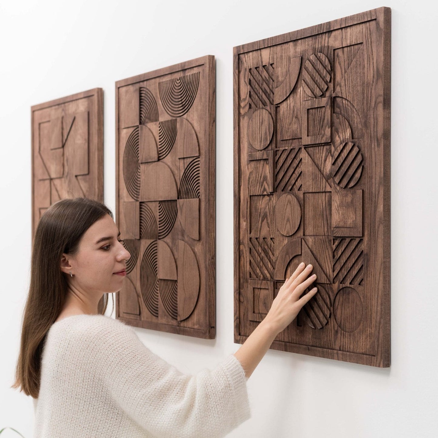Bauhaus wood wall art panel, natural finish, on a wall