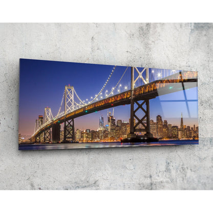 San Francisco Bay Bridge panoramic glass wall art shown at an angle on a concrete wall