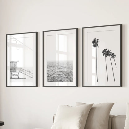 Black and white coastal wall art set of 3 with palms, ocean waves, and a lifeguard tower