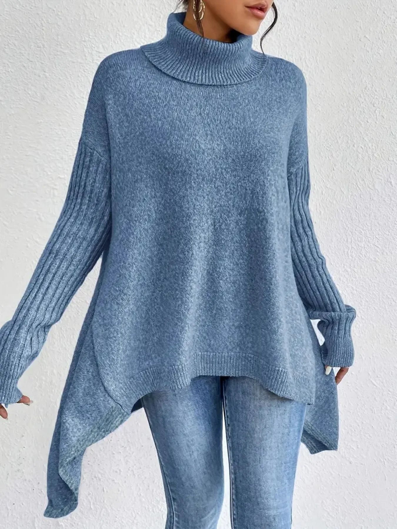 blue asymmetric turtleneck knit sweater on woman
