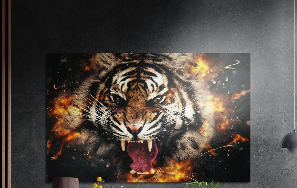 Roaring tiger face in orange flames and sparks brushed aluminum wall art on a dark gray wall above plants