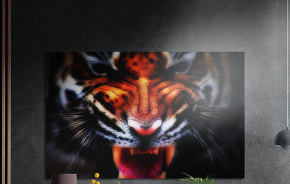 Snarling tiger face brushed aluminum wall art on a dark textured wall beside wood slats and a lamp