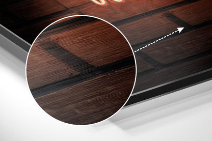 Magnified detail of the brushed metal grain showing through the neon music sign print