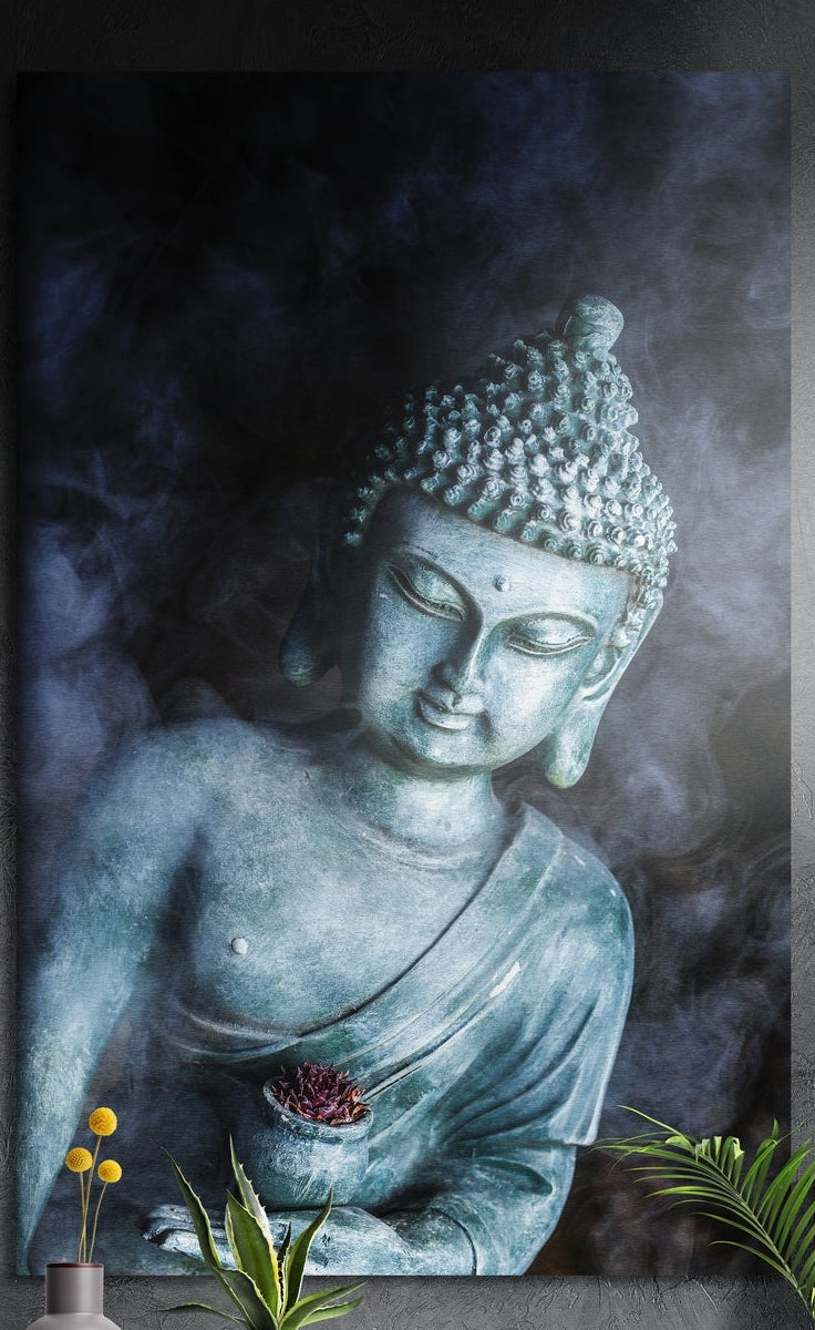 Smoky blue Buddha statue brushed aluminum wall art on a dark gray wall above yellow flowers and green plants