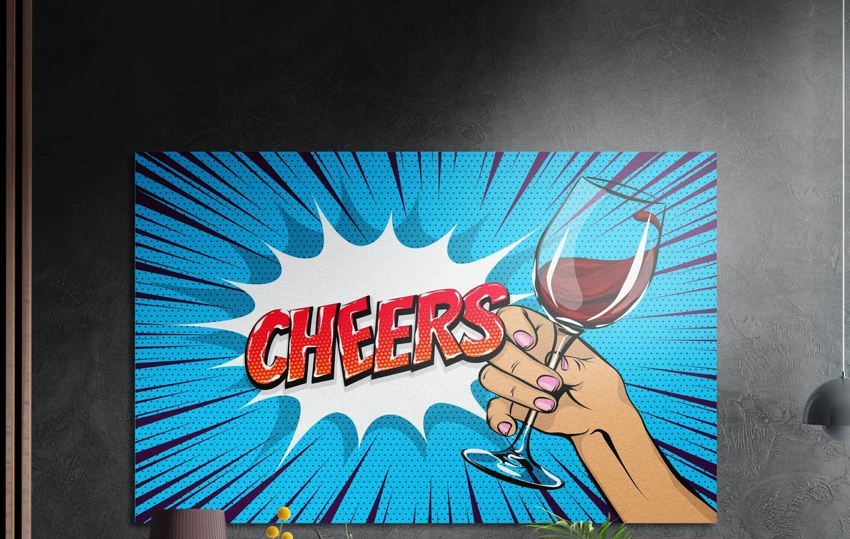Comic cheers wine toast brushed aluminum wall art on a dark textured wall beside a slatted wood panel
