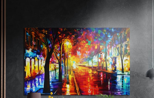 Rainy lamplit street with colorful trees brushed aluminum wall art on a dark textured wall above a lamp and plants