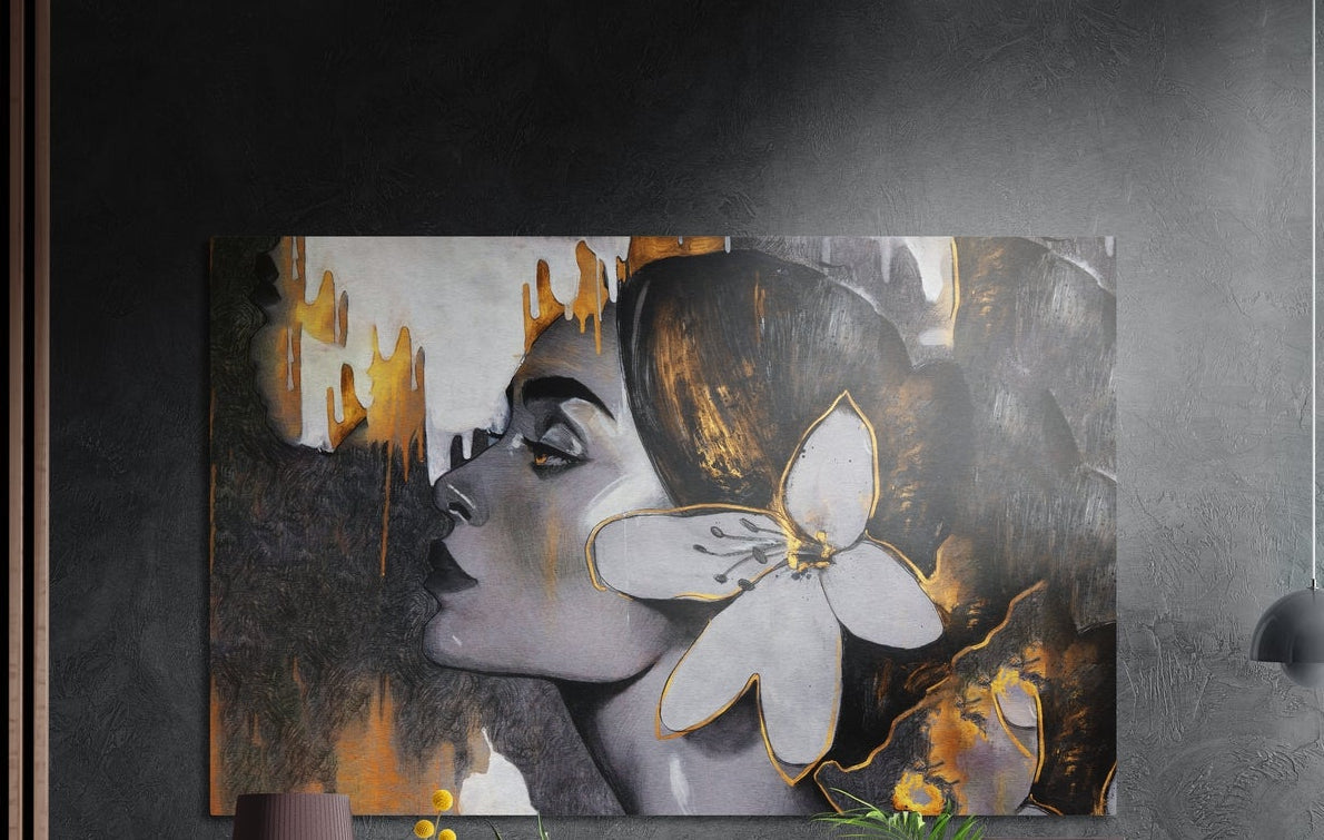 Woman in profile with a white flower in her hair in gray and gold, brushed aluminum wall art on a dark textured wall