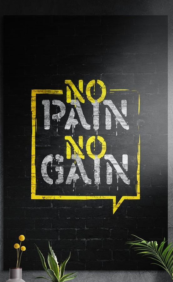 No pain no gain yellow stencil lettering on black brick brushed aluminum wall art above yellow flowers and plants