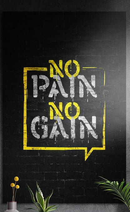 No pain no gain yellow stencil lettering on black brick brushed aluminum wall art above yellow flowers and plants