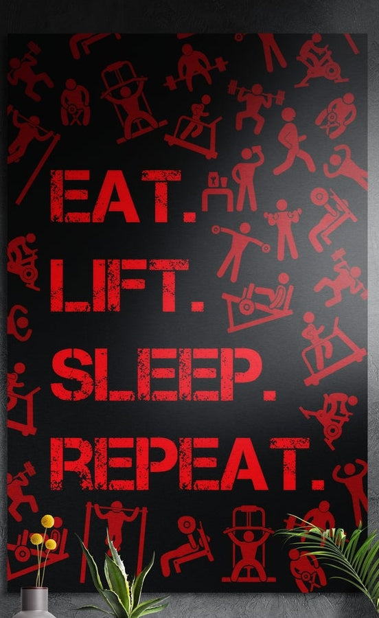 Red gym icons and routine words brushed aluminum wall art on a dark gray wall above yellow flowers and plants