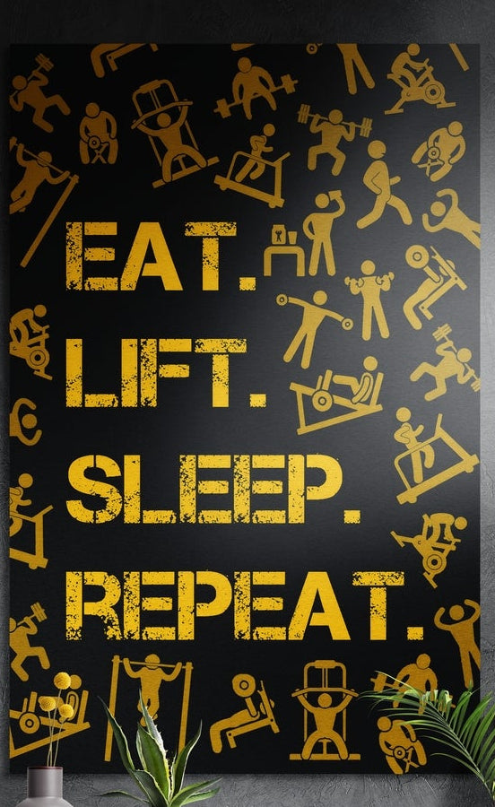 Gold eat lift sleep repeat lettering with workout icons on black, brushed aluminum wall art above a wooden sideboard
