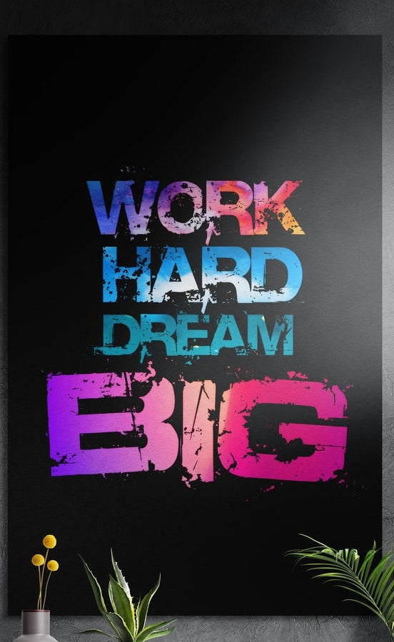 Work hard dream big colorful distressed lettering on black brushed aluminum wall art above yellow flowers and plants