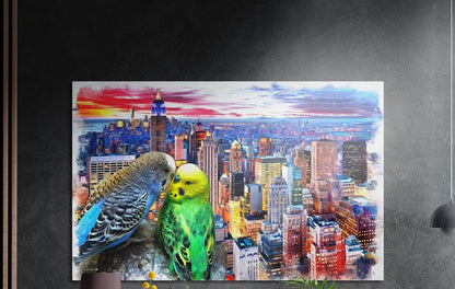 Budgies in love over a city skyline brushed aluminum wall art on a dark wall above the tips of potted plants