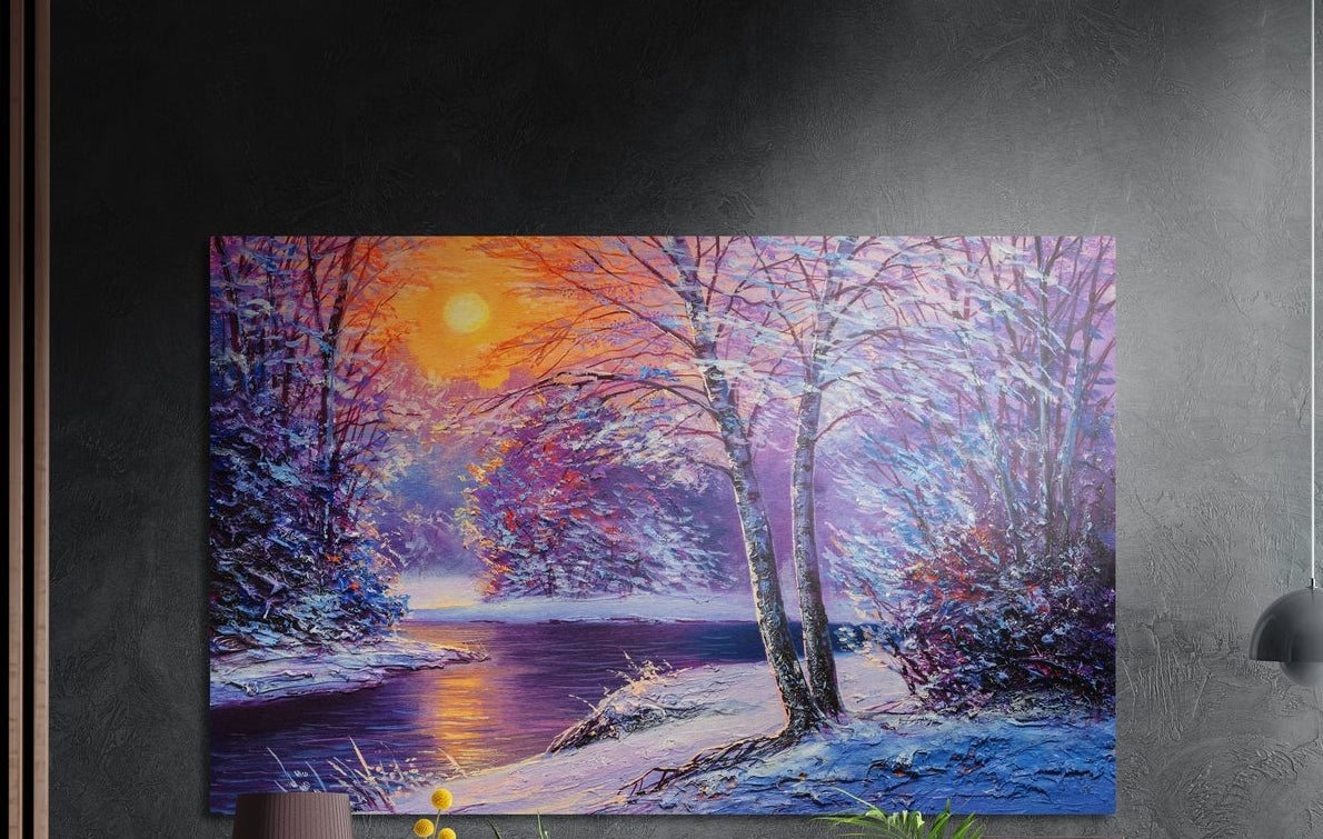 Snowy winter river brushed aluminum wall art on a dark gray wall above a sideboard with a vase and plants