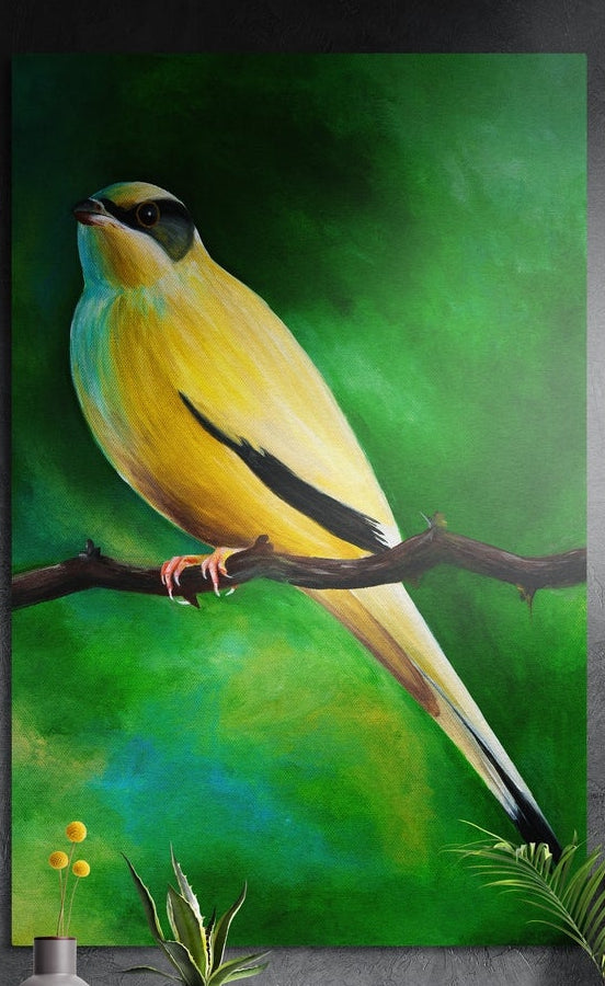 Yellow bird on a branch brushed aluminum wall art on a dark wall above yellow flowers and plants