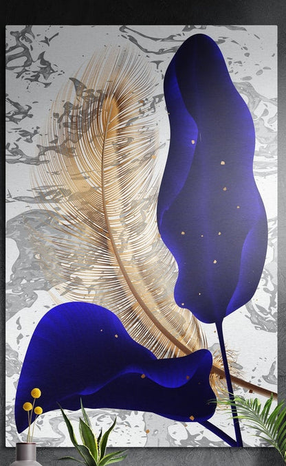 Navy petals and gold feather on marble brushed aluminum wall art on a dark wall above yellow flowers and plants
