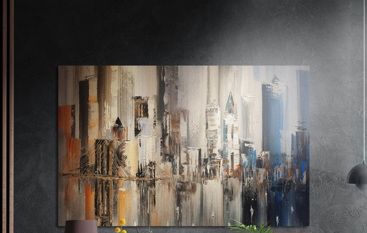 Abstract earth tone city skyline brushed aluminum wall art on a dark textured wall beside wood slats and a lamp