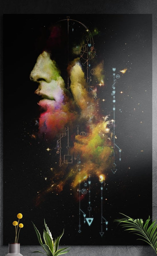 Face in colored smoke profile brushed aluminum wall art on a dark wall above yellow flowers and green plants
