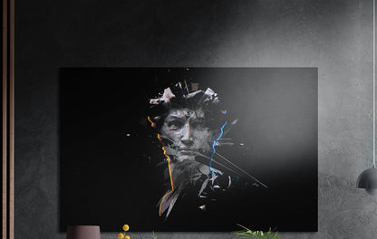 Shattered classical statue head brushed aluminum wall art on a dark wall above the tips of potted plants