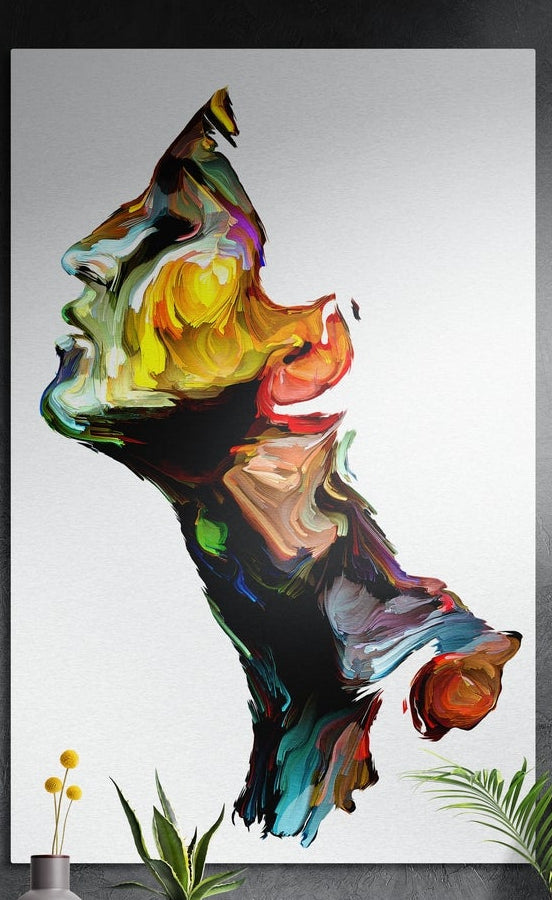 Rainbow swirl face on white brushed aluminum wall art hung on a dark textured wall above potted plants