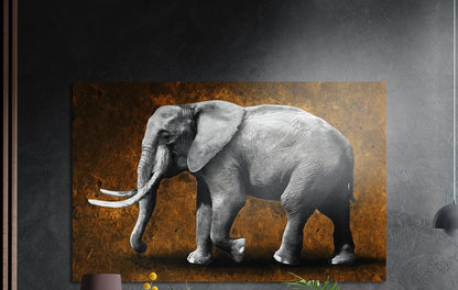 Gray elephant with white tusks in profile on a textured amber background, brushed aluminum wall art on a dark wall