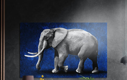 Gray elephant with white tusks in profile on a textured deep blue background, brushed aluminum wall art on a dark wall