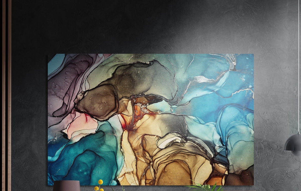 Teal and ochre fluid ink marble with silver veins, brushed aluminum wall art on a dark textured wall