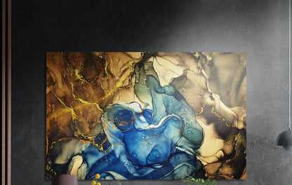 Cobalt blue and amber marble ink brushed aluminum wall art on a dark gray wall above a mauve lamp and plants
