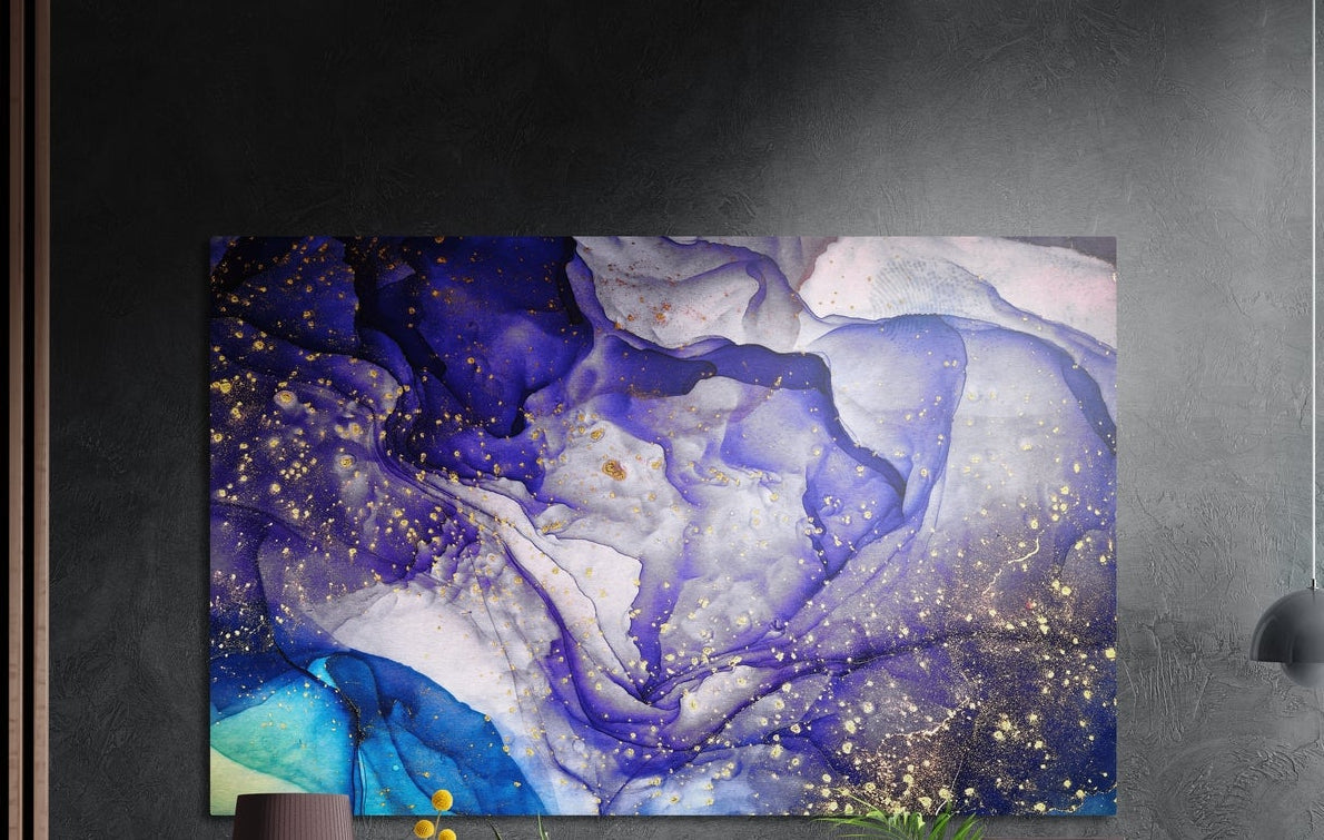 Purple and gold fluid abstract brushed aluminum wall art on a dark textured wall