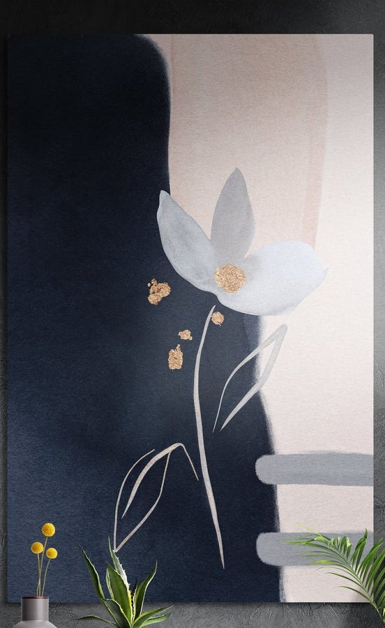 White flower on navy and blush brushed aluminum wall art on a dark textured wall behind a vase and plants