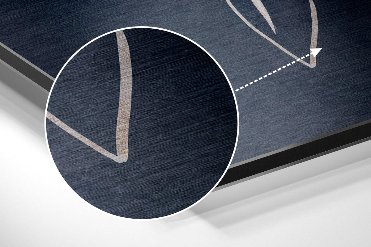 Magnified detail of the brushed metal grain showing through the white flower on navy and blush print