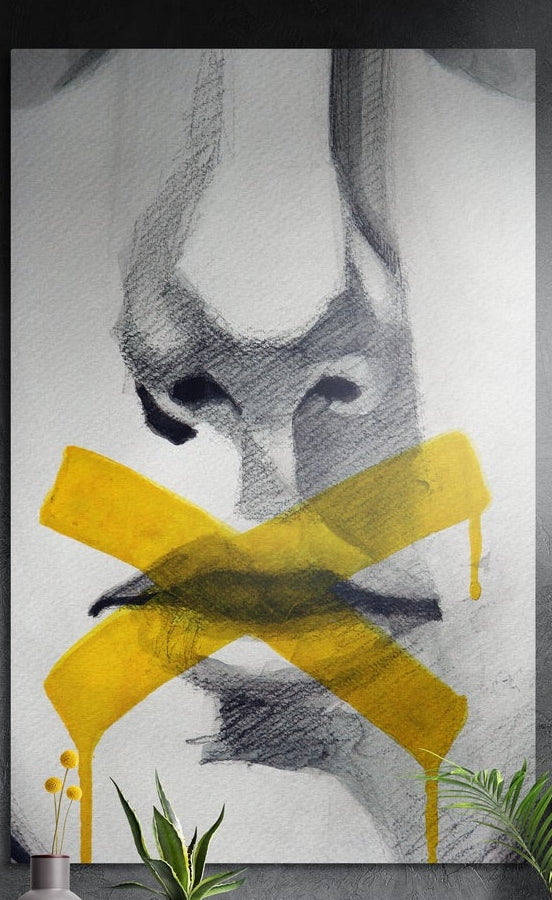 Yellow paint X over lips sketch brushed aluminum wall art on a dark textured wall above yellow flowers and potted plants