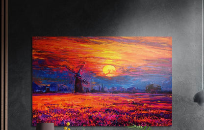 Windmill sunset brushed aluminum wall art on a dark gray wall above a sideboard with a vase and plants